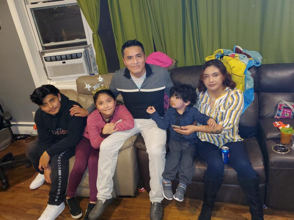 Joe Derrick with his family at a Tri State Gutters company gathering, showing how we value our team members' families