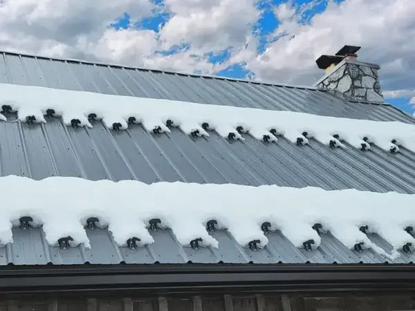 Snow guards on roof - Need: 600x500px image of roof with snow guards installed showing snow retention